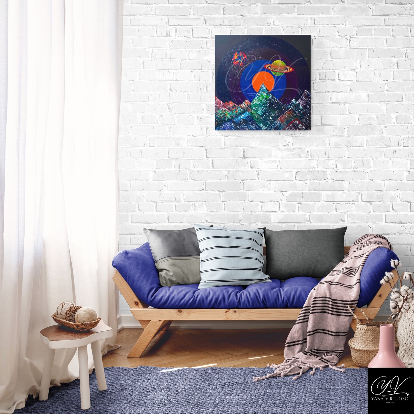 Yana Virtuoso's 'Manifestation' painting in a living room setting, creating an astral focal point with its vibrant planetary depictions.